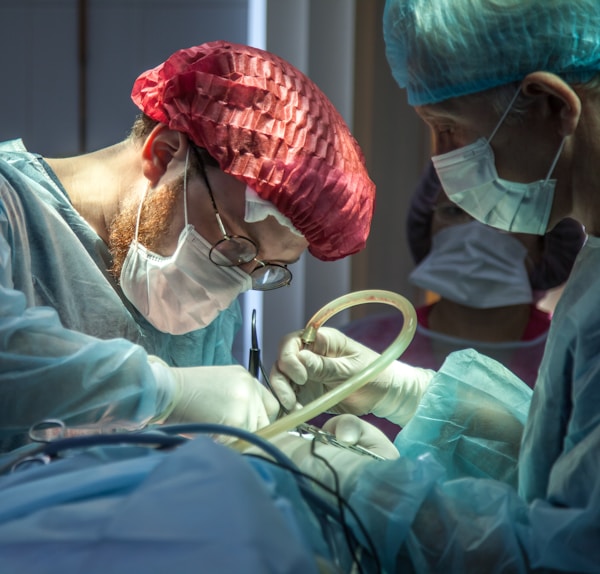 a person in a hospital operating on a patient